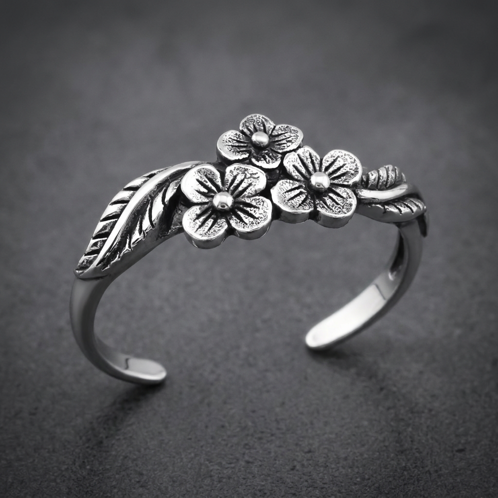 Marbled Bloom Ring stainless-steel floral design. Three textured flower blossoms with leaves on a silver band.