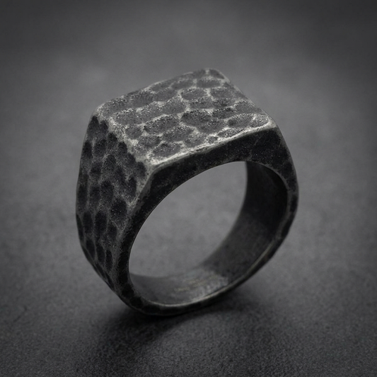 Hammered finish 316L stainless steel HardKnocker ring with a square face in a dark, antique silver tone.