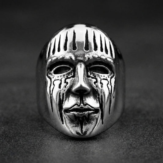 GRIMMWACHT™ Remnant I DEATHMASK LEGION™ Ring made of 316L stainless steel, featuring a melted, crying skull face design with jagged crown-like top.