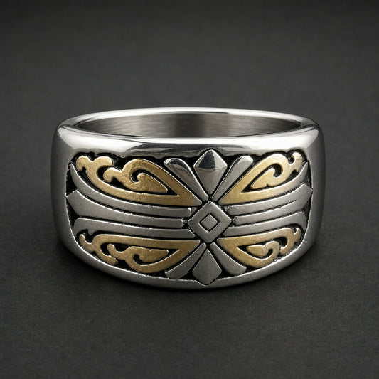 Heavy two-tone gold and silver 316L stainless steel ring with intricate script pattern on a wooden surface.