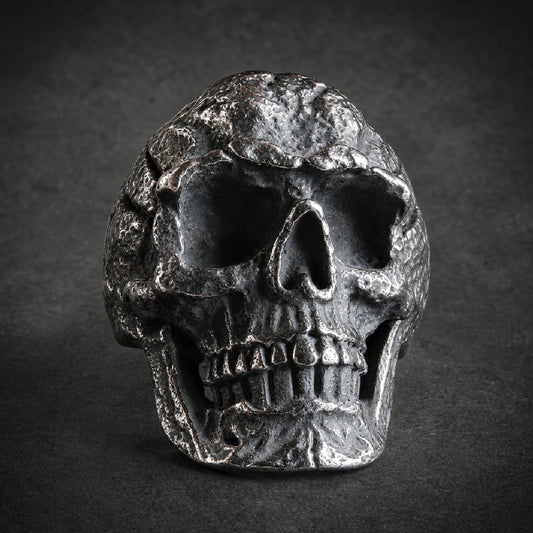 Heavy-duty 316L surgical stainless steel skull ring with deep-set eyes, grimace, and textured, weathered finish.