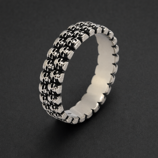 316L stainless steel ring with three rows of small, dark, textured skulls, hardknocker style, for unisex wear