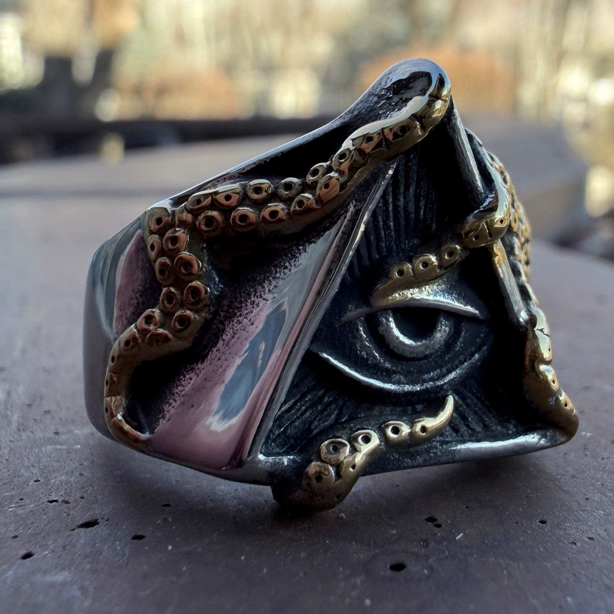 Men’s pyramid eye ring with gold tentacle accents in stainless steel