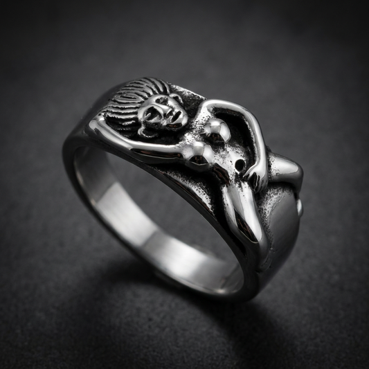 A close-up view of the Naughty Ring, showcasing its polished 316L surgical stainless steel finish and subtle yet daring design details.