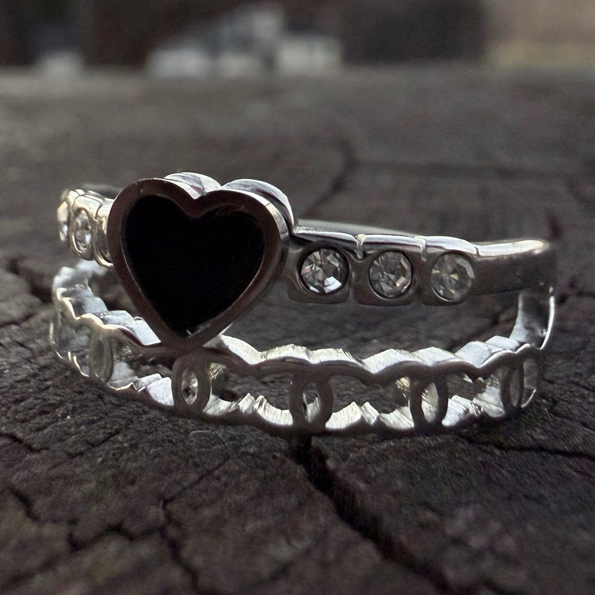 Stainless steel heart ring featuring a dark center and clean finish