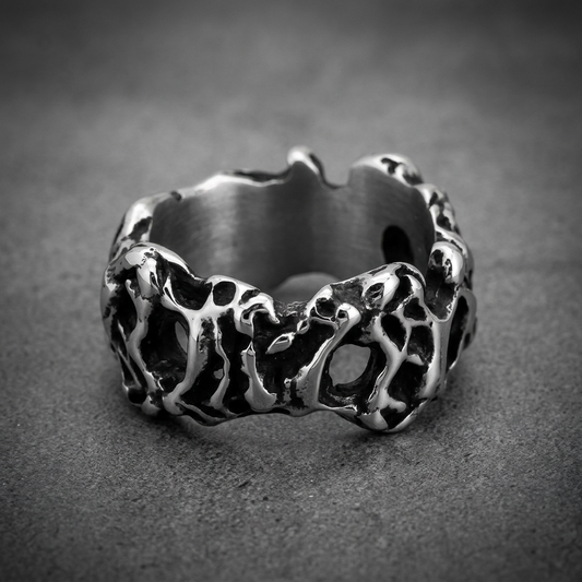 Heavy 316L stainless steel ring with an organic, molten, textured surface and dark recesses, in a polished silver finish.