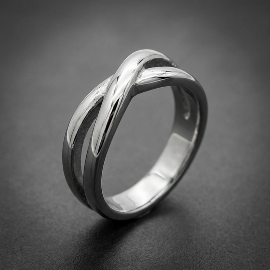 Polished silver 316L stainless steel X-band ring with a smooth, intertwining design and a high-shine finish.