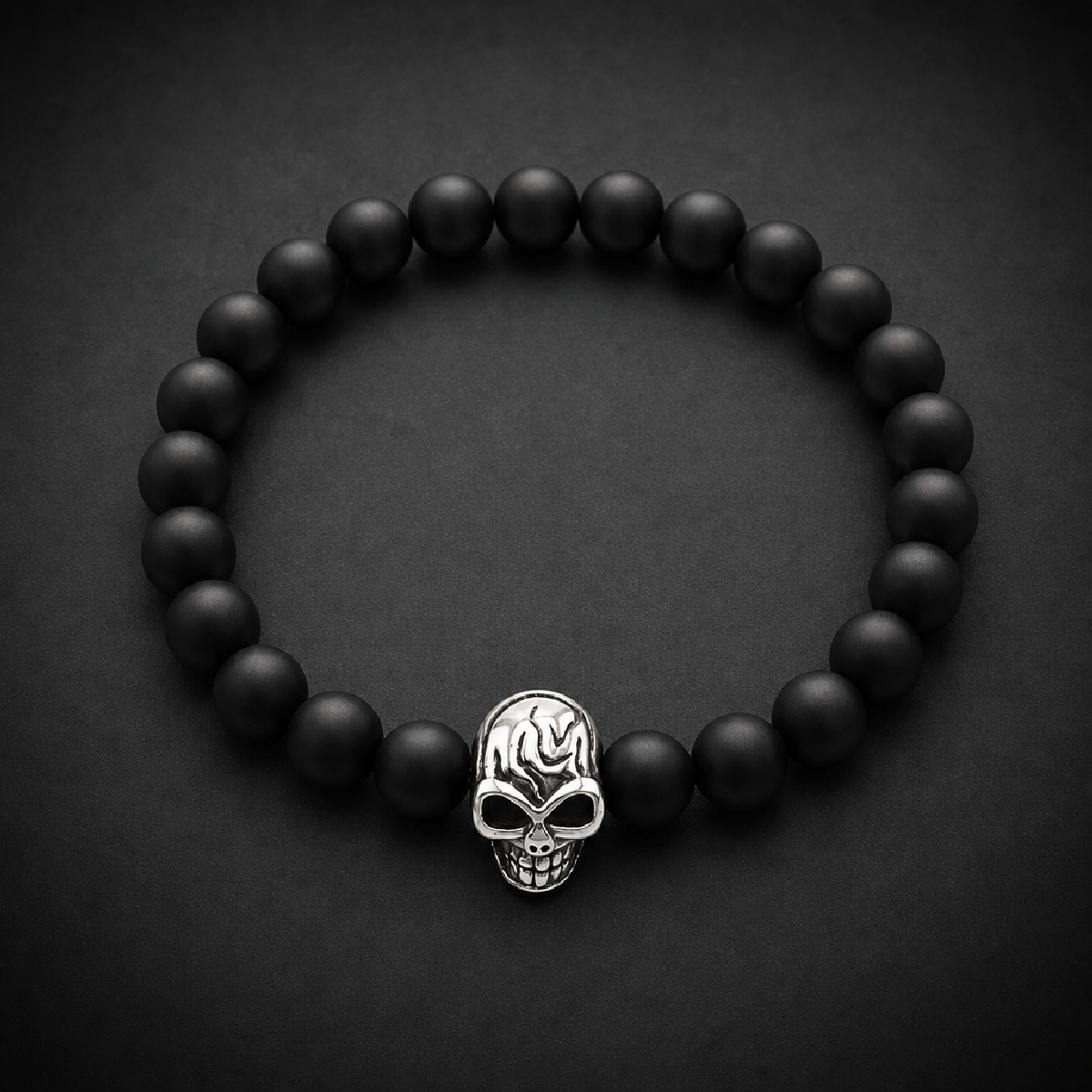 Black beaded bracelet with a single, detailed silver 316L surgical stainless steel skull bead in the center.