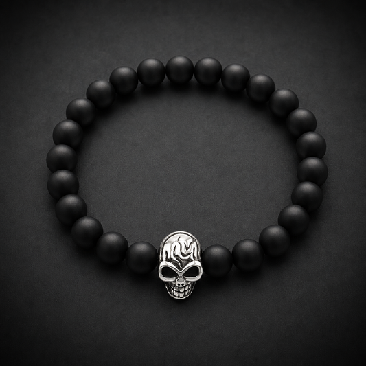 Black beaded bracelet with a single, detailed silver 316L surgical stainless steel skull bead in the center.