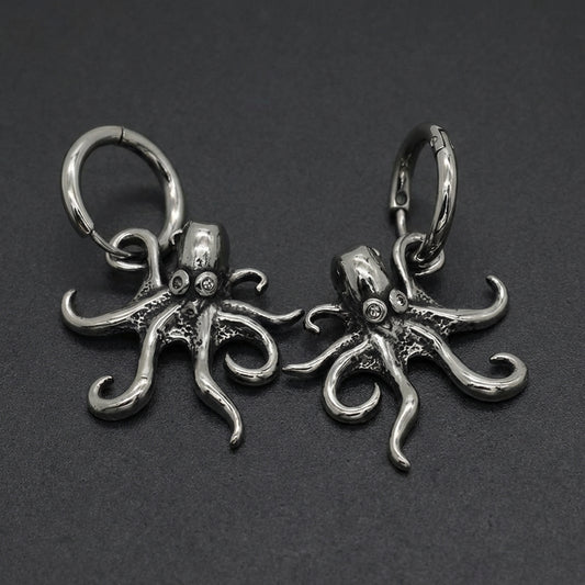 A pair of silver-toned Oceanic Tentacle Hoops earrings, featuring detailed octopus tentacle designs curling around a hinged hoop.