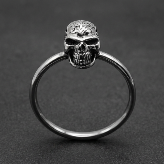 Silver 316L stainless steel ornate skull HardKnocker ring with fierce floral details on the skull and a minimalist band.