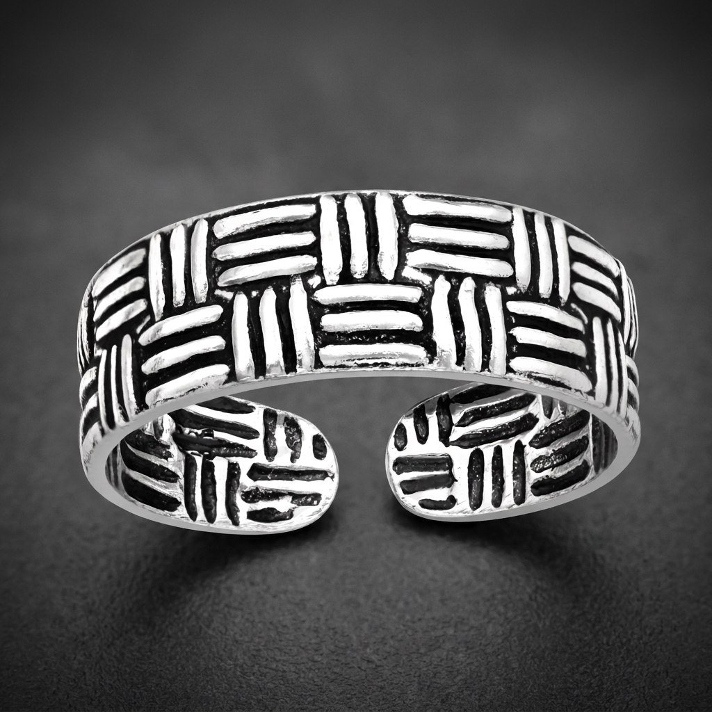 Paramount Weave Ring, 316L stainless steel with a bold interwoven basket-weave pattern, dark oxidized recesses, and high-polish raised elements.