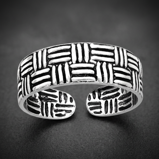 Paramount Weave Ring, 316L stainless steel with a bold interwoven basket-weave pattern, dark oxidized recesses, and high-polish raised elements.