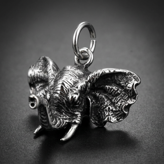 Heavy 316L stainless steel elephant head pendant with detailed wrinkled skin texture, large flared ears, and prominent tusks, in a polished silver-tone finish.