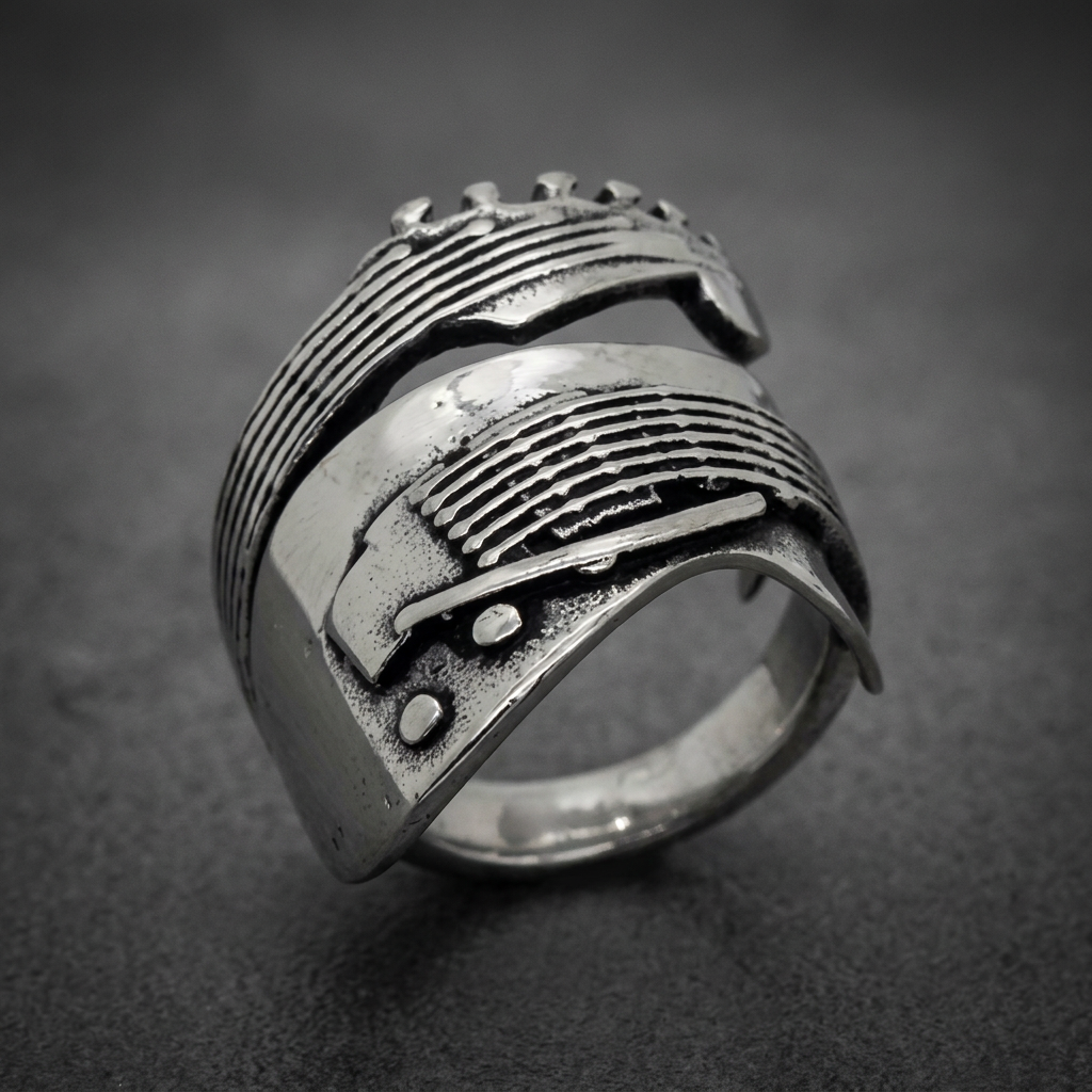 Polished ribbed ring made from 316L surgical stainless steel, featuring deep parallel grooves and rivets, silver in color.