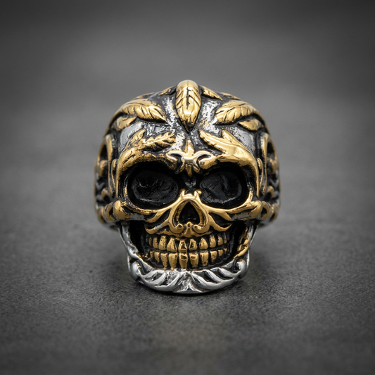 Dual-tone gold and blackened 316L stainless steel skull ring with intricate floral leaf patterns