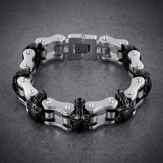 Heavy 316L stainless steel motorcycle chain bracelet with three black skull beads and polished silver links.