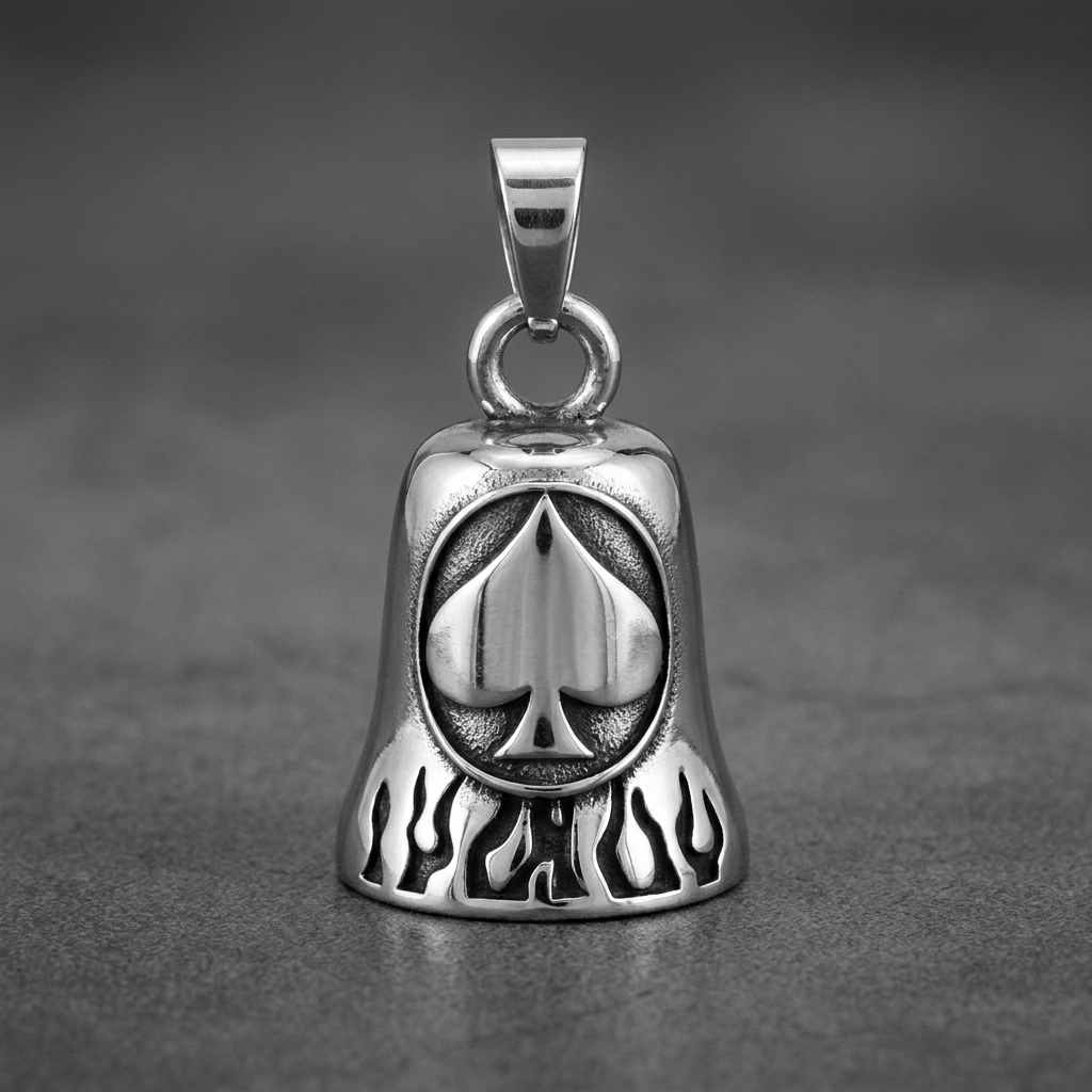Highly polished 316L stainless steel biker bell featuring a central spade icon surrounded by etched flames, set against a dark grey background.