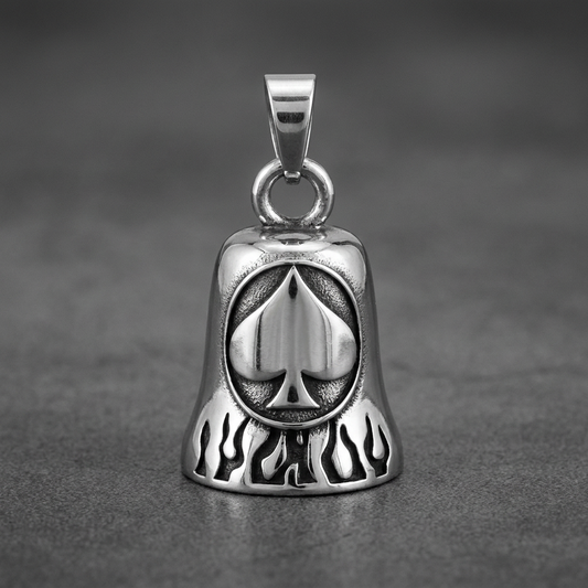 Highly polished 316L stainless steel biker bell featuring a central spade icon surrounded by etched flames, set against a dark grey background.