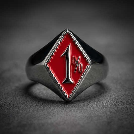 1% Red Hardknocker ring, polished 316L stainless steel with a striking crimson red enamel arrow design, dark background.
