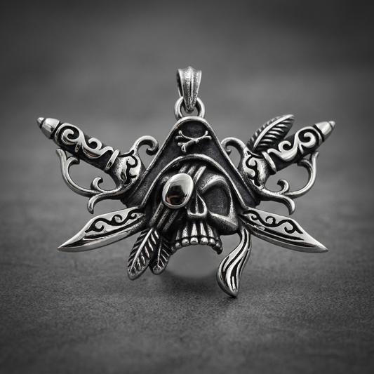 Prime Skull Dagger Pendant 316L stainless steel, featuring a central skull flanked by two ornate daggers and feathers, in a dark silver finish.