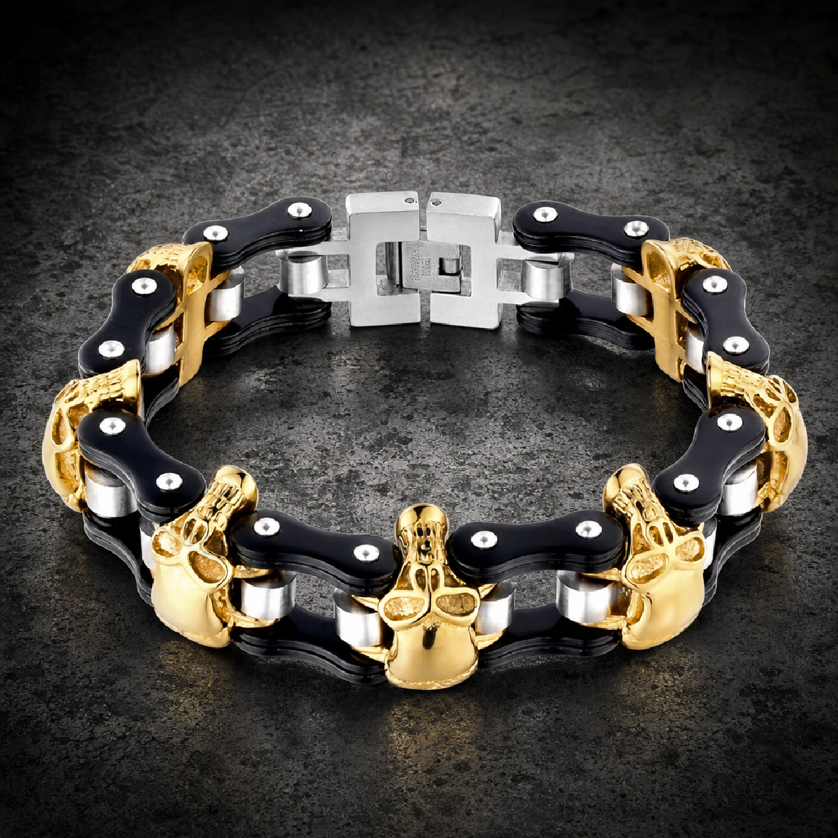 Reaper's Ride: A heavy, wide 316L stainless steel biker bracelet featuring gold-tone skull links intertwined with black PVD coated motorcycle chain links, secured by a polished stainless steel clasp.