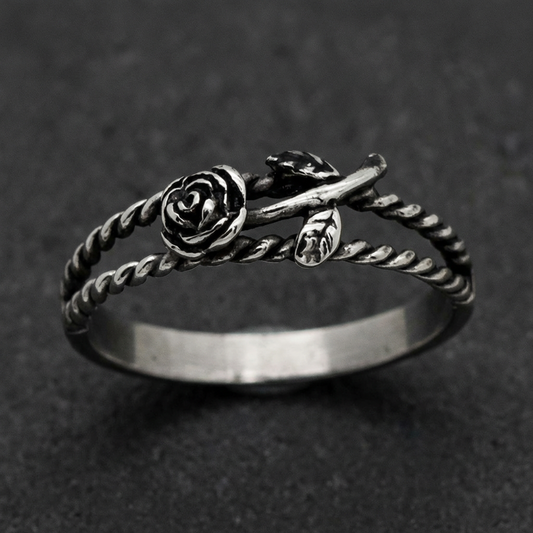 Twisted Vine Rose Ring in 316L stainless steel, featuring an oxidized dark rose on a twisted band. A dark romance themed ring.
