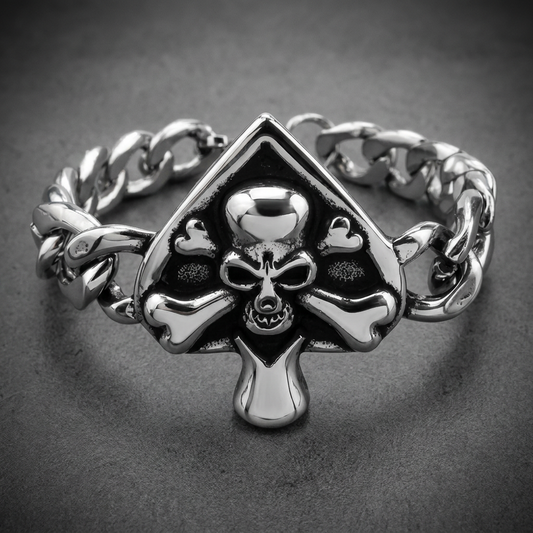 Heavy 316L stainless steel bracelet featuring a prominent spade-shaped centerpiece with an engraved skull and crossbones design, attached to a thick Cuban link chain.