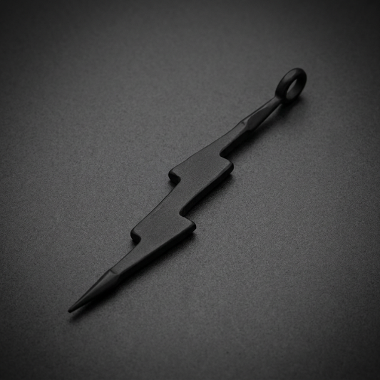 Matte black lightning bolt pendant made from 316L stainless steel, featuring sharp angles and a pointed tip.