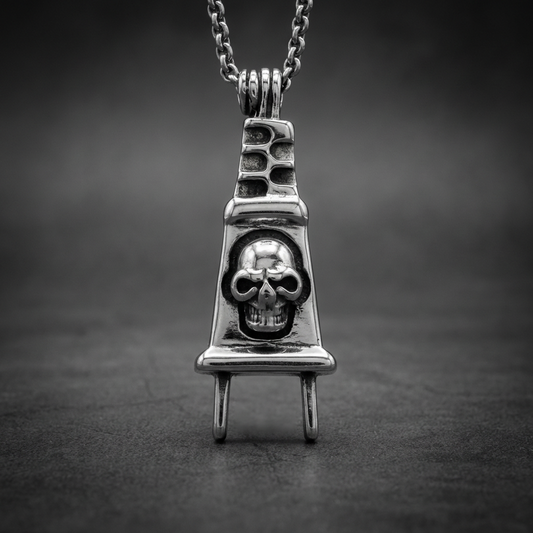High Voltage Reaper pendant featuring a formidable skull carved into a stylized electric plug design, crafted from polished 316L stainless steel.
