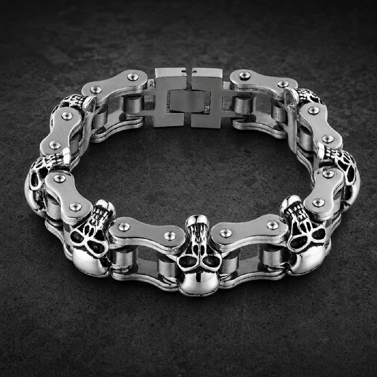 Silver polished 316L surgical stainless steel biker bracelet with skull motifs, motorcycle chain links, and secure Box / Slide clasp.