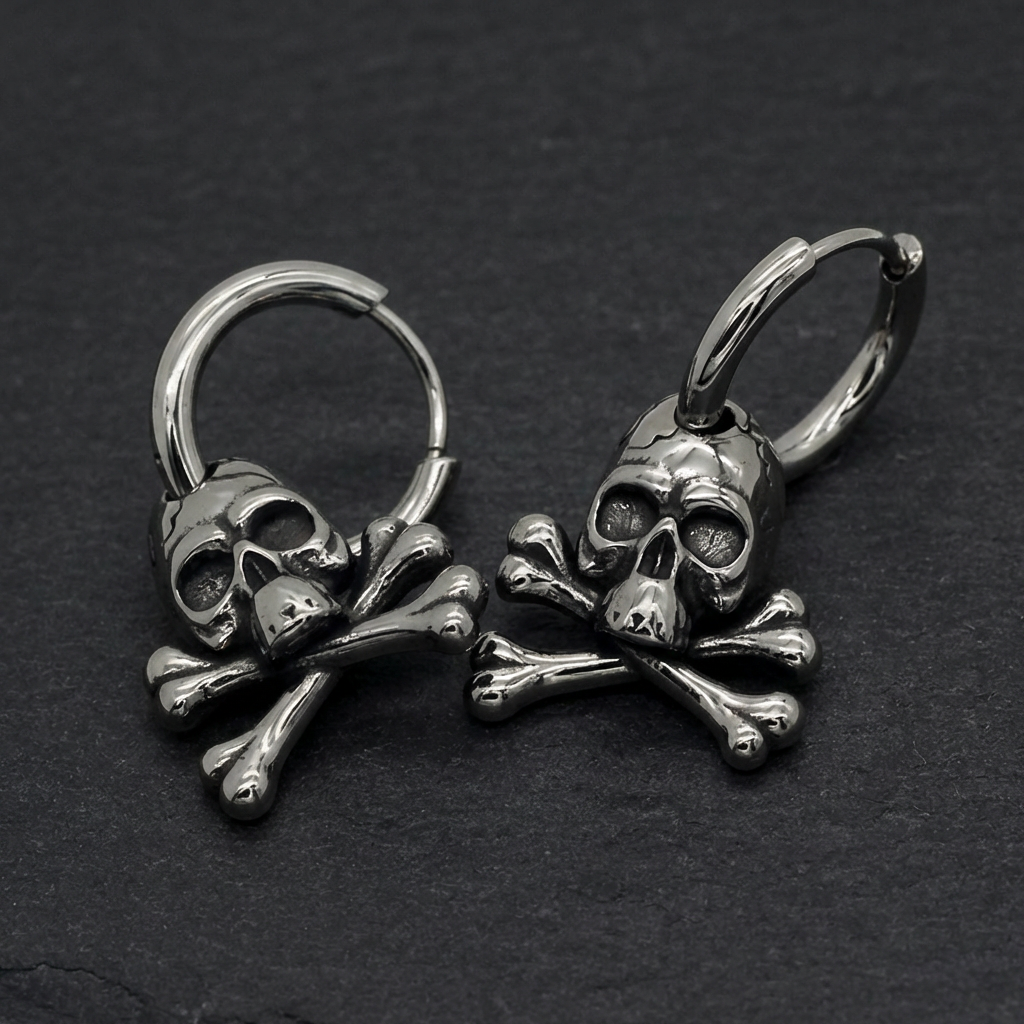 A pair of Death's Embrace Earrings, featuring 316L stainless steel skull and crossbones on hinged hoops, showcasing their menacing design.