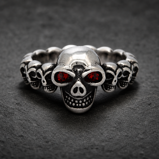 A close-up of the Dark Skull Legion Ring with glowing red eyes, crafted from 316L stainless steel, against a dark, dramatic background.