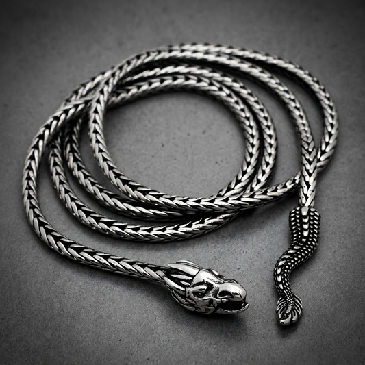 Sovereign Serpent Chain 36 inch necklace in 316L stainless steel, featuring a detailed serpent head clasp and woven chain pattern on a dark background.