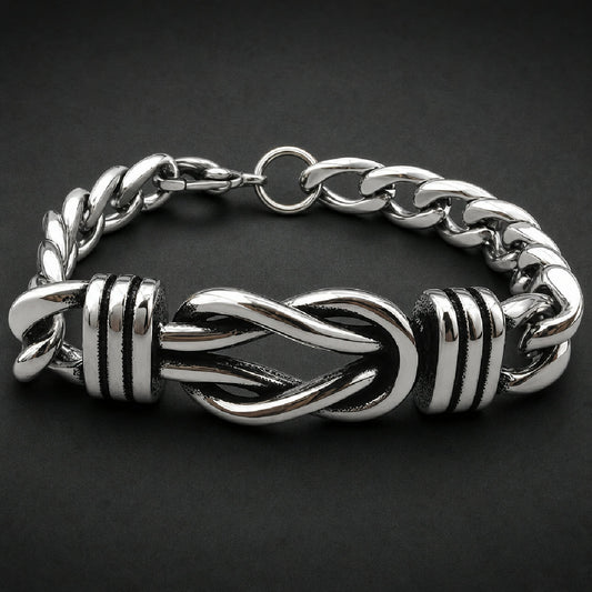 Unisex 316L stainless steel bracelet featuring an entwined cinch centerpiece with grooved end caps and heavy curb links