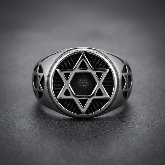 Stoic Hexagram Ring, 316L stainless steel with a prominent hexagram symbol in the center, flanked by smaller hexagrams on the band. Silver-colored, dark recesses.