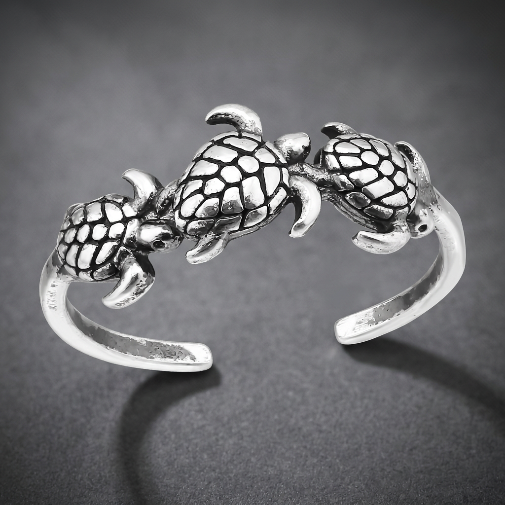Silver 316L stainless steel Stoic Turtle Band ring featuring three detailed turtles on top.