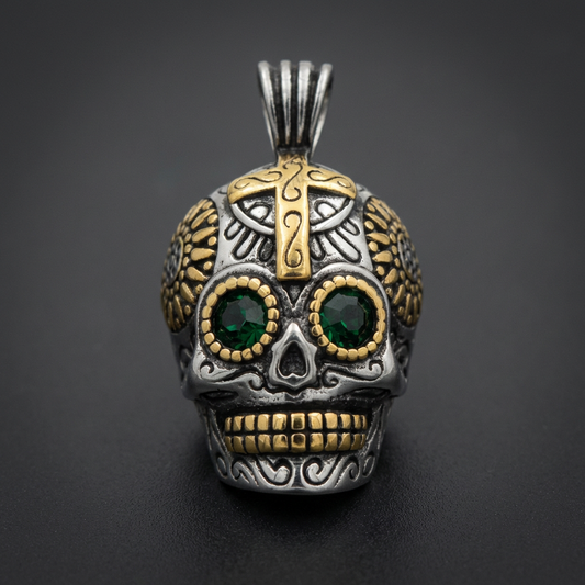 Large Ornate Sugar Skull Pendant made of 316L stainless steel with gold accents and emerald eyes, showcasing intricate carved details.