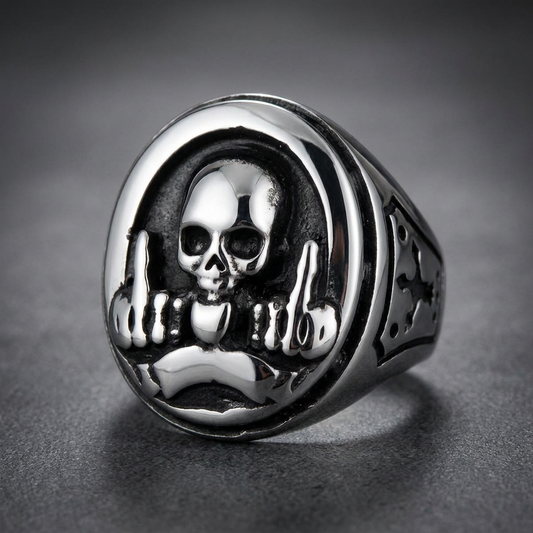 Solid 316L stainless steel ring featuring a central skull flanked by two hands flipping the bird set in a dark, polished HardKnocker™ design.