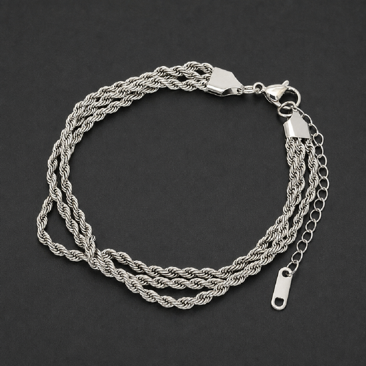 Triple Rope Bracelet in bright 316L surgical stainless steel, featuring three intertwined rope chains, a lobster clasp, and an extender chain, on a white background.