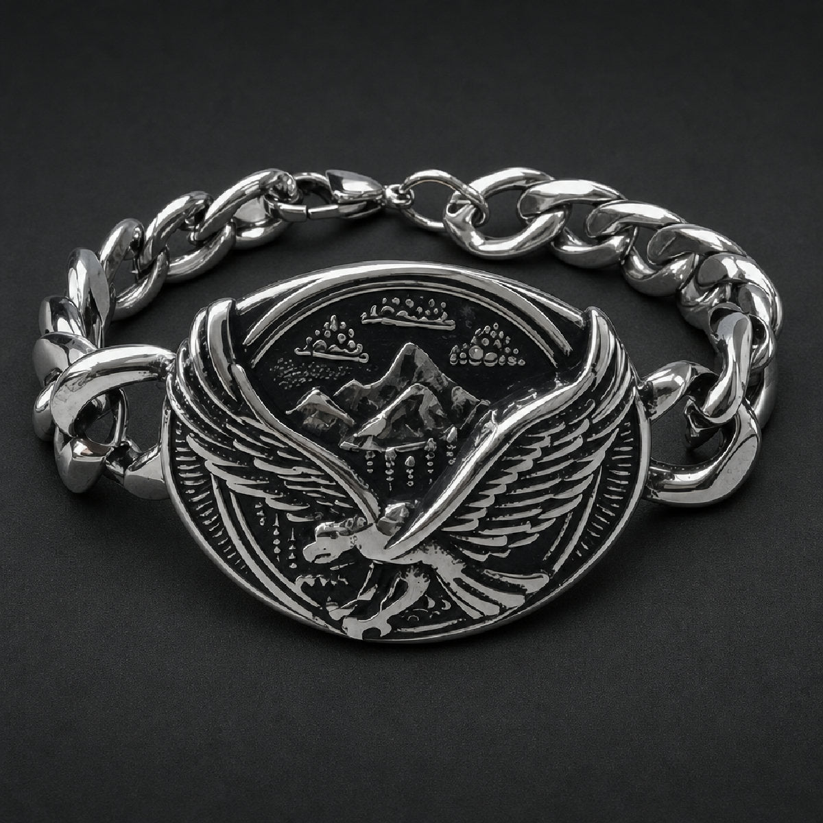 316L stainless steel curb chain bracelet with oval centerpiece depicting a soaring eagle raptor over mountain peaks in black and silver