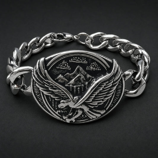 316L stainless steel curb chain bracelet with oval centerpiece depicting a soaring eagle raptor over mountain peaks in black and silver