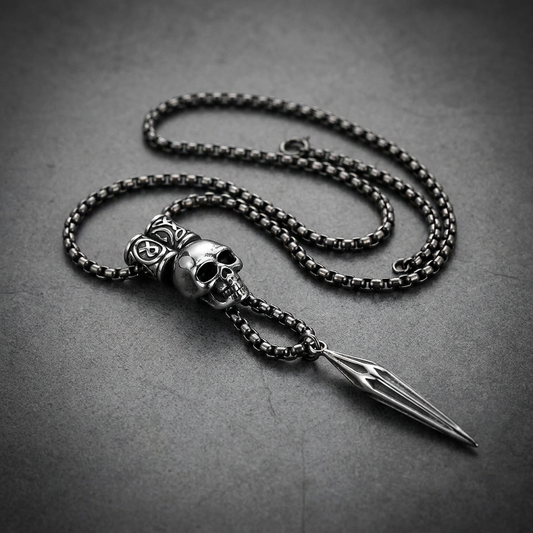 Vanguard Skull 34 inch Necklace in 316L surgical stainless steel, featuring a prominent skull head attached to a sharp, barbed dart pendant with a dark, antique chain.