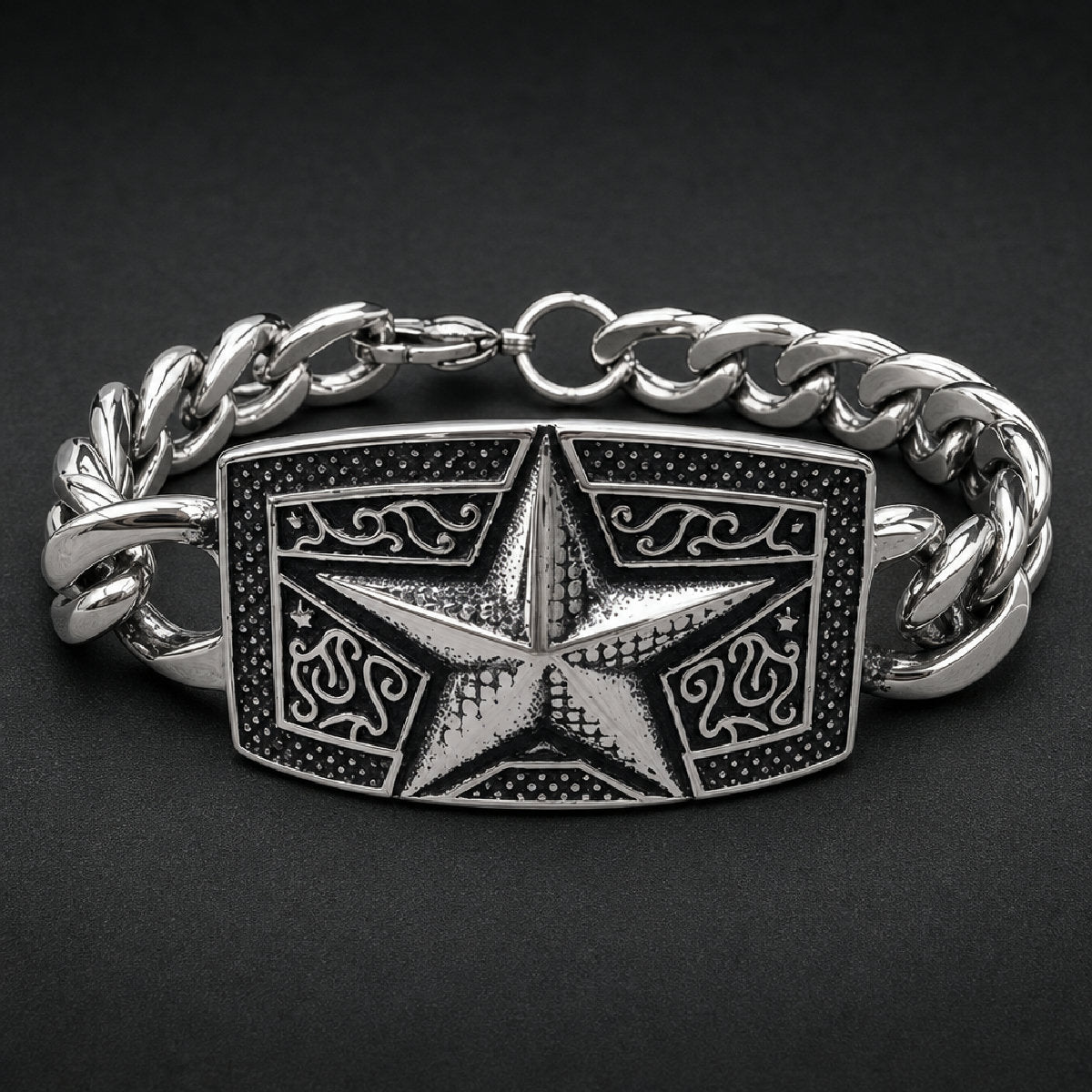 Heavy 316L stainless steel unisex bracelet featuring a dimensional five-point star centerpiece with black oxidized scrollwork and curb chain