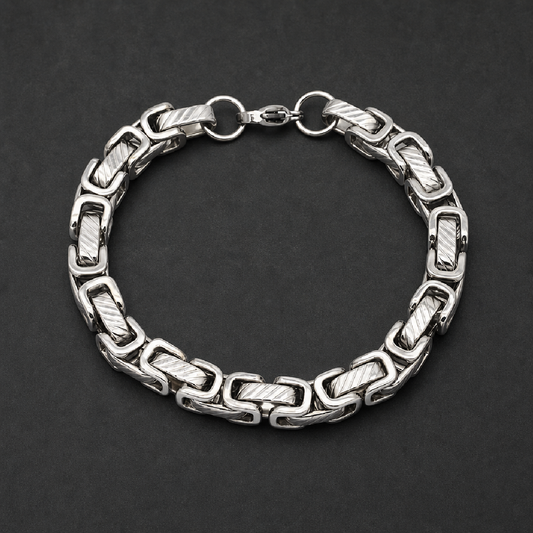 Thick heavy polished 316L stainless steel bar link bracelet with intricate textured rectangular segments connected by smooth round links, secured by a lobster clasp.