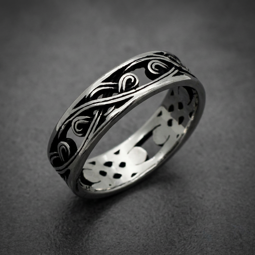 Unisex 316L stainless steel ring with intricate polished and blackened swirl pattern on a white background.