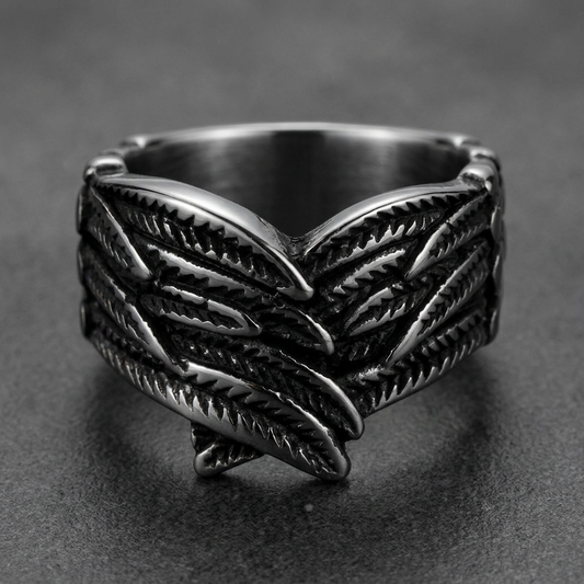 Heavy 316L stainless steel ring with a detailed feathered wing motif, dark silver finish.