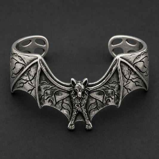 Front view of 316L stainless steel bat cuff bracelet featuring spread wings with oxidized webbing and textured body