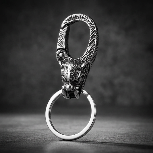 A detailed close-up of the Imperial Wolf Keychain, showcasing the intricately carved wolf head design made from brushed 316L stainless steel.
